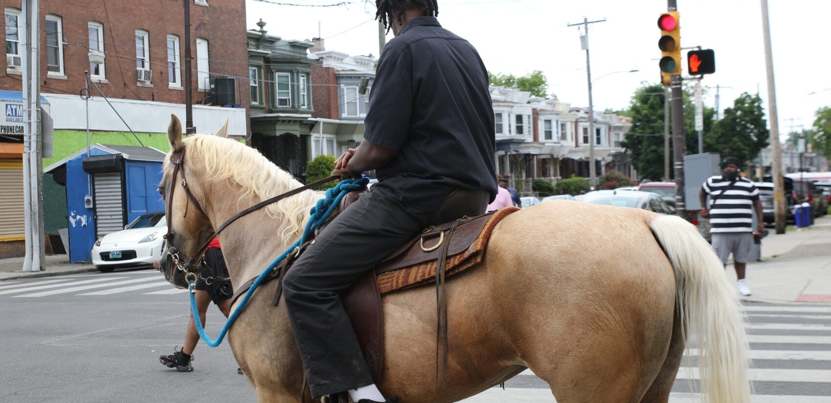 It wouldn't be the Juneteenth Parade and Festival without a horse sighting on 52nd Street. (Cory Sharber/WHYY)