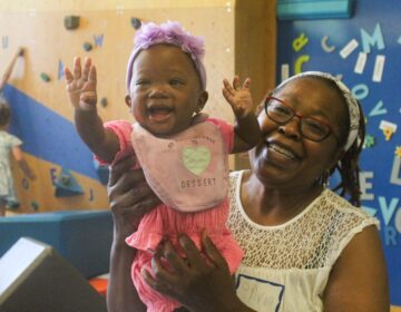 Families and children visit the Cecil B. Moore Library in Philadelphia on Sat., June 22, 2024 to celebrate the launch of the Philly Joy Bank and escape the heat wave at one of the city’s designated cooling centers. (Nicole Leonard/WHYY)