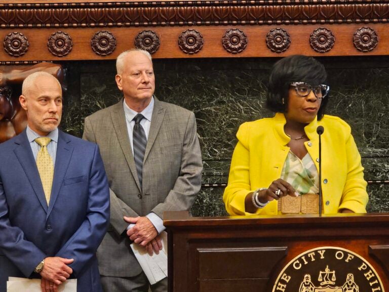 Mayor Cherelle Parker (right), Local 159(b) Eric Desiderio (middle) and Michael Resnik, prisons commissioner, speak at the arbitration announcement June 17, 2024. (Tom MacDonald, WHYY)