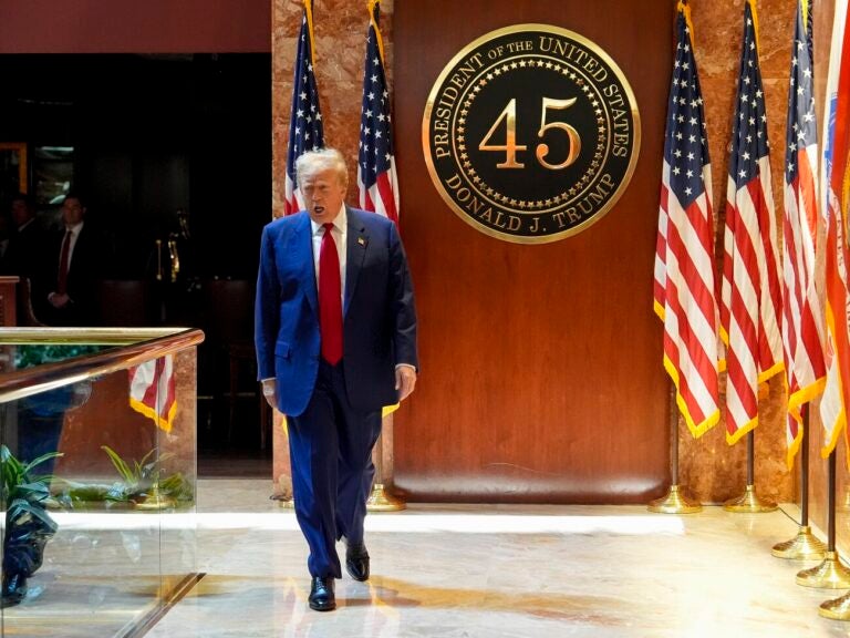 Trump walking inside Trump Tower