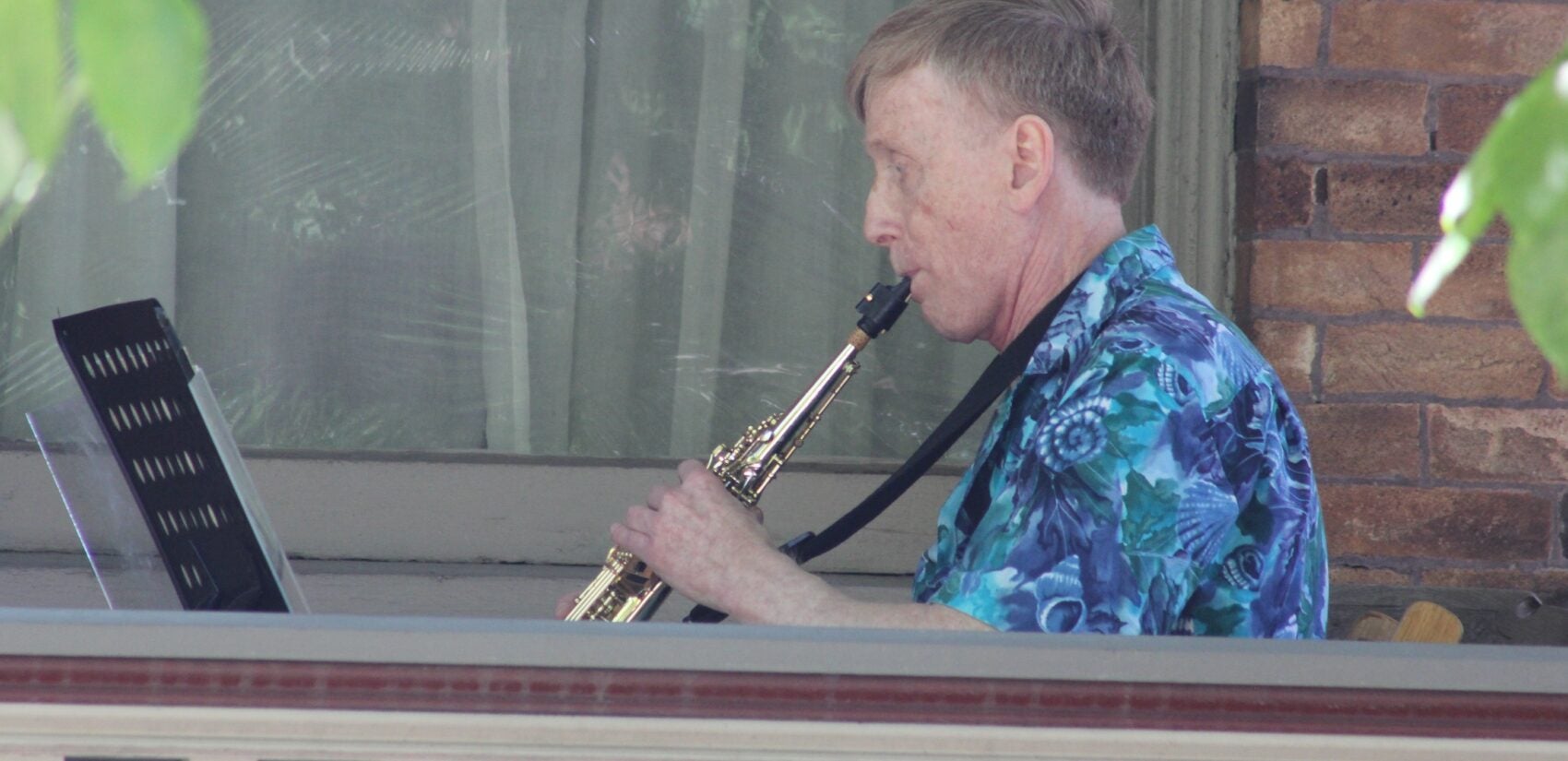 a person plays a wind instrument