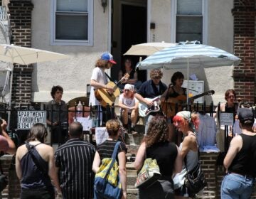 Porchfest attendees watch a band