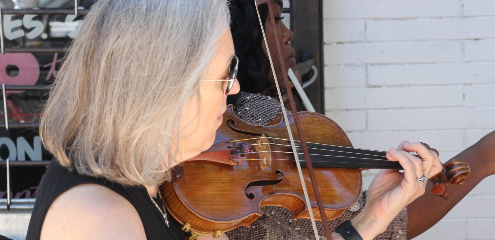 a person plays a viola