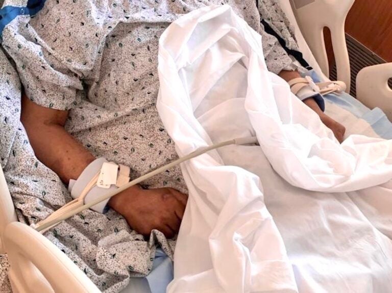 A carpenter who is undocumented and uninsured recovers in a hospital bed after being struck by a motorcycle on Roosevelt Boulevard in Philadelphia, Pa. (Courtesy of Claudia Martínez).