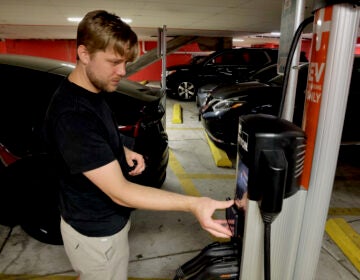 Nate Golubiewski trying to use an EV charging station