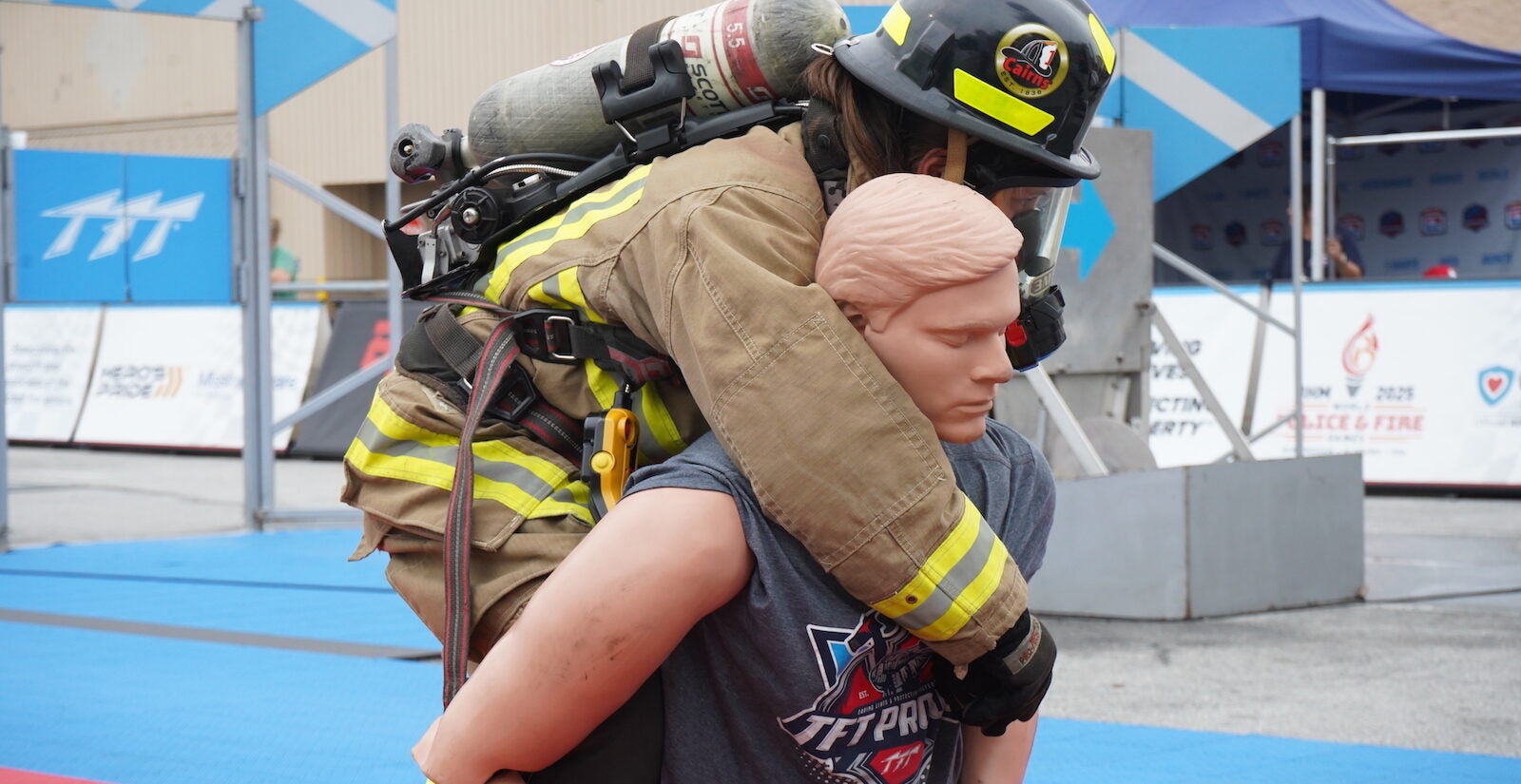 A firefighter dragging a mannequin