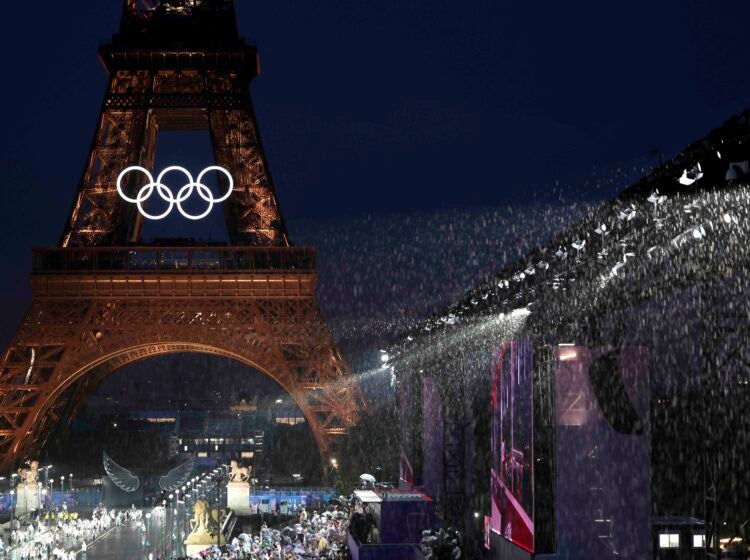 Rain falls in front of the Eiffel Tower, in Paris, France, during the opening ceremony of the 2024 Summer Olympics, Friday, July 26, 2024. (Pascal Le Segretain/Pool Photo via AP)