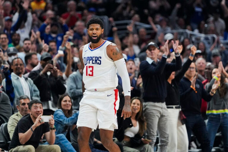 Paul George celebrates on the court