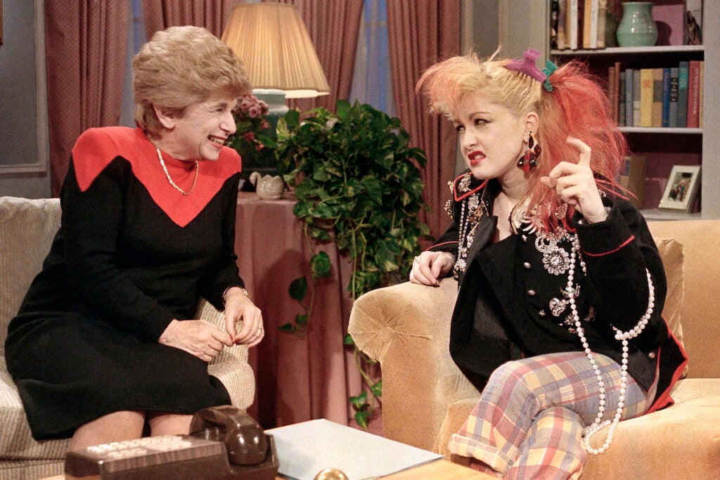 Sex therapist Dr. Ruth Westheimer talks with rock singer Cyndi Lauper