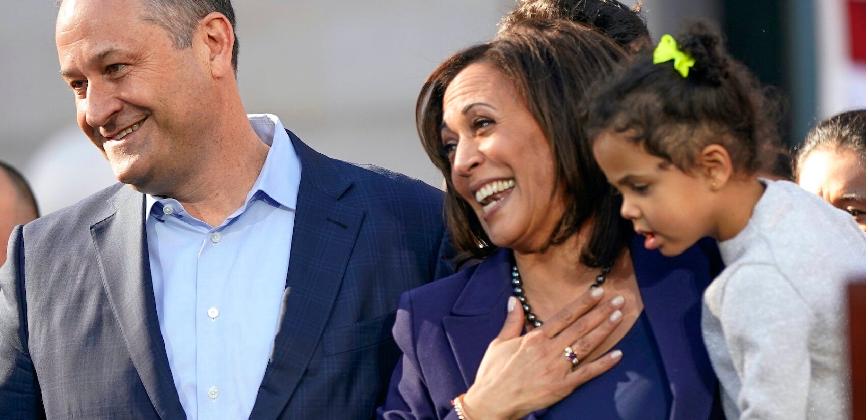 U.S. Sen. Kamala Harris, of D-California, holds her niece Amara Ajagu, right, next to her husband Douglas Emhoff, left, as she formally launch her presidential campaign at a rally in her hometown of Oakland, Calif., Sunday, Jan. 27, 2019. (AP Photo/Tony Avelar)