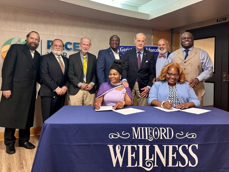 The official signing of the $5 million, five-year Geriatric Workforce Enhancement Program that will take place at the Milford Wellness Village, the projects base location. (Johnny Perez-Gonzalez/WHYY)