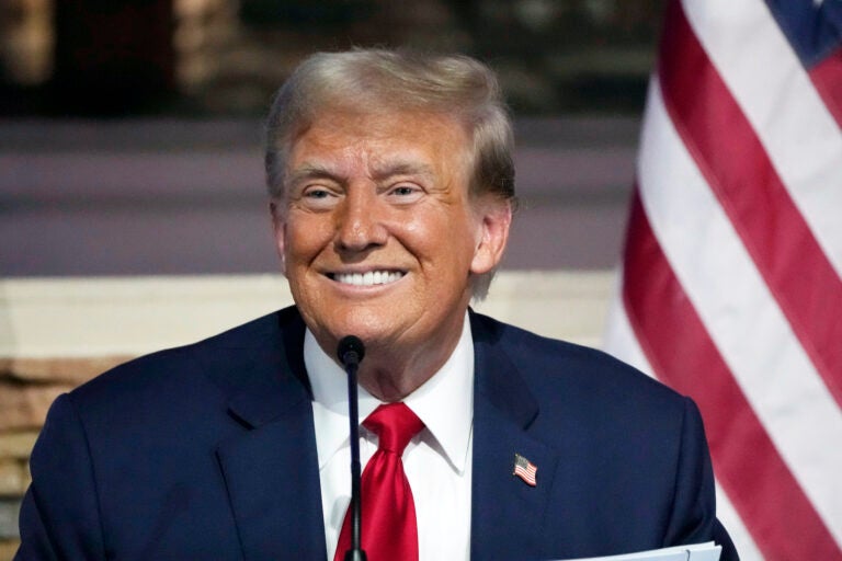 Donald Trump smiling intensely