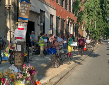 People form a ''human-protected bike lane'' on Spruce Street