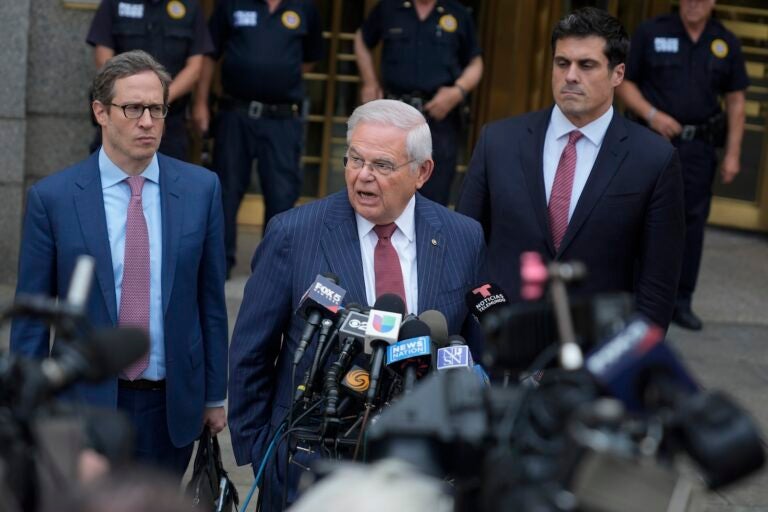 Sen. Bob Menendez, D-N.J., center, speaks to reporters as he leaves federal court in New York, Tuesday, July 16, 2024.