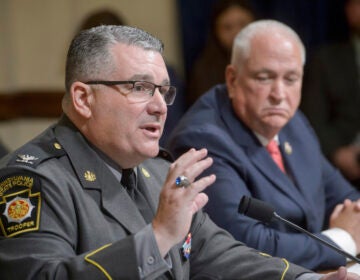Patrick Yoes, National President, Fraternal Order of Police, right, listens as Colonel Christopher L. Paris, Commissioner, Pennsylvania State Police, left, responds to questions during a House Committee on Homeland Security hearing examining the assassination attempt of July 13, on Capitol Hill, Tuesday, July 23, 2024, in Washington. (AP Photo/Rod Lamkey, Jr.)