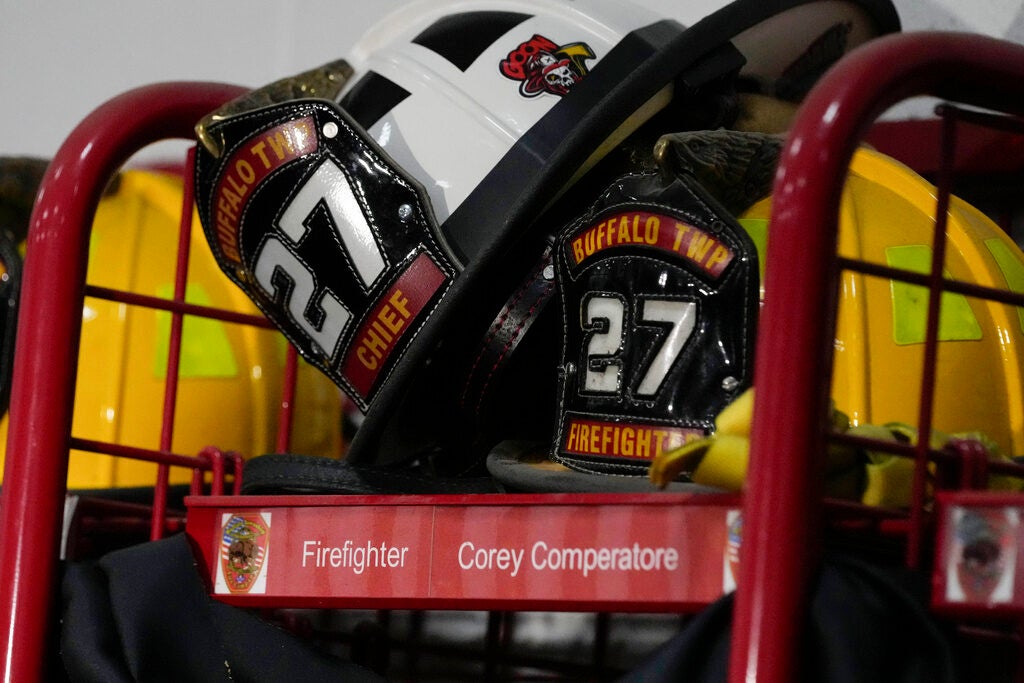 Helmets rest on the locker of firefighter Corey Comperatore at the Buffalo Township Fire Company 27 in Buffalo Township, Pa., Sunday, July 14, 2024. Comperatore was killed during a shooting at a campaign rally for Republican presidential candidate former President Donald Trump in Butler, Pa., on Saturday.