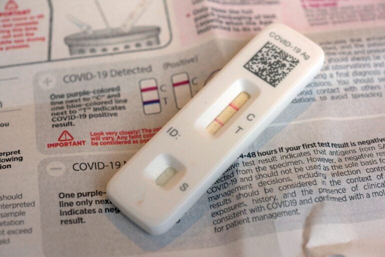 A COVID-19 antigen home test indicating a positive result