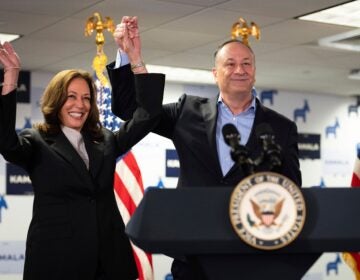 FILE - Vice President Kamala Harris, left, and second gentleman Doug Emhoff address staff at her campaign headquarters in Wilmington, Del., July 22, 2024. The nation's first second gentleman, Emhoff could become its first first gentlemen after November. Emhoff is used to traveling the country championing his wife and the Biden administration's accomplishments in his current job. But now that Harris is the presumptive Democratic nominee, those efforts have been thrust into the political spotlight like never before. (Erin Schaff/The New York Times via AP, Pool, File)