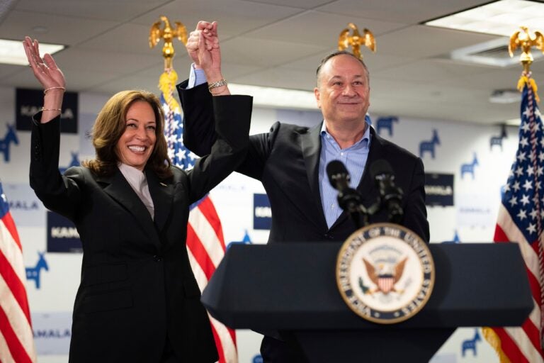 FILE - Vice President Kamala Harris, left, and second gentleman Doug Emhoff address staff at her campaign headquarters in Wilmington, Del., July 22, 2024. The nation's first second gentleman, Emhoff could become its first first gentlemen after November. Emhoff is used to traveling the country championing his wife and the Biden administration's accomplishments in his current job. But now that Harris is the presumptive Democratic nominee, those efforts have been thrust into the political spotlight like never before. (Erin Schaff/The New York Times via AP, Pool, File)