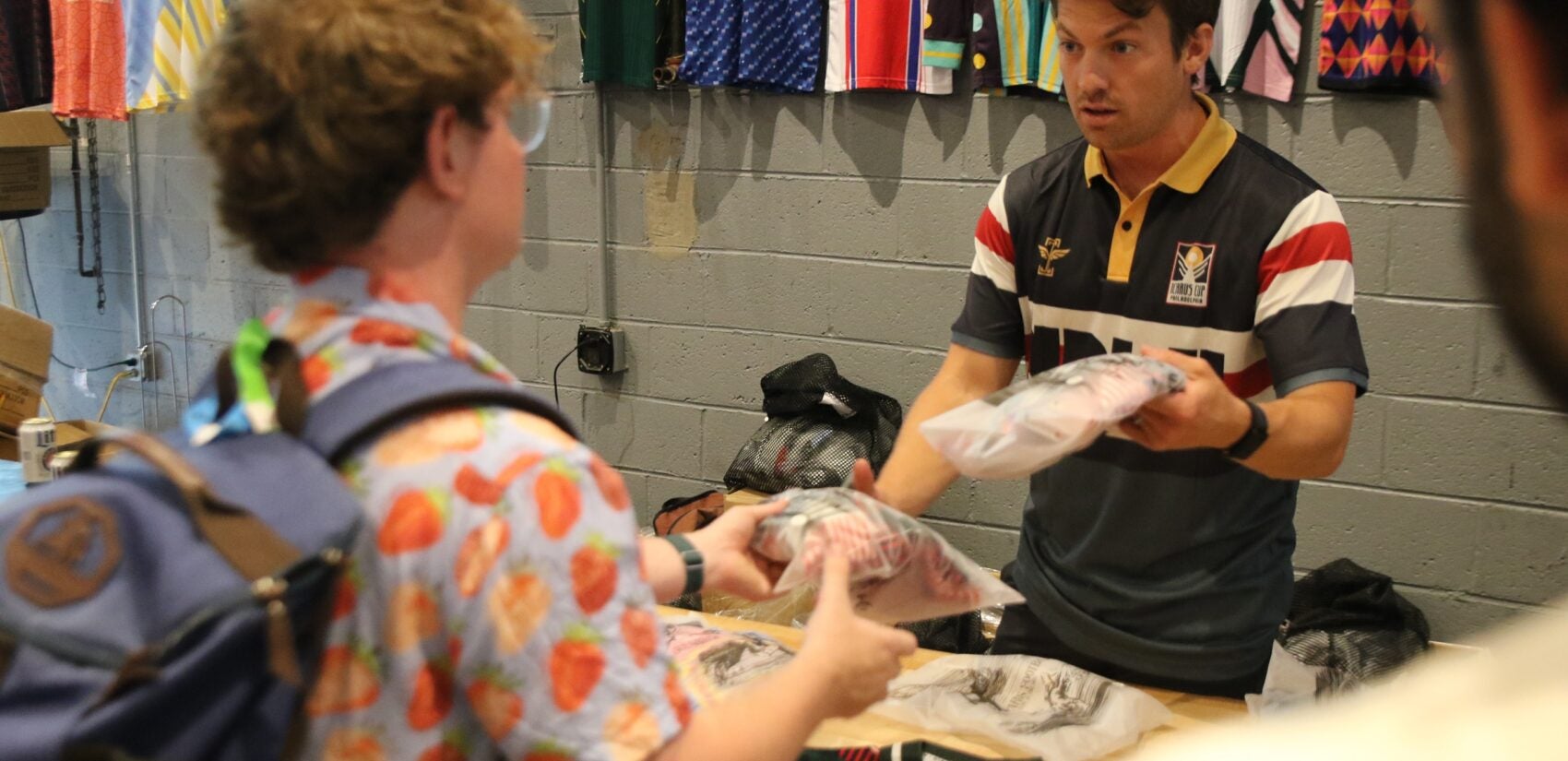 Players picked up their kits and soaked up the vibes during a pre-tournament gathering at Craft Hall on Friday. (Cory Sharber/WHYY)