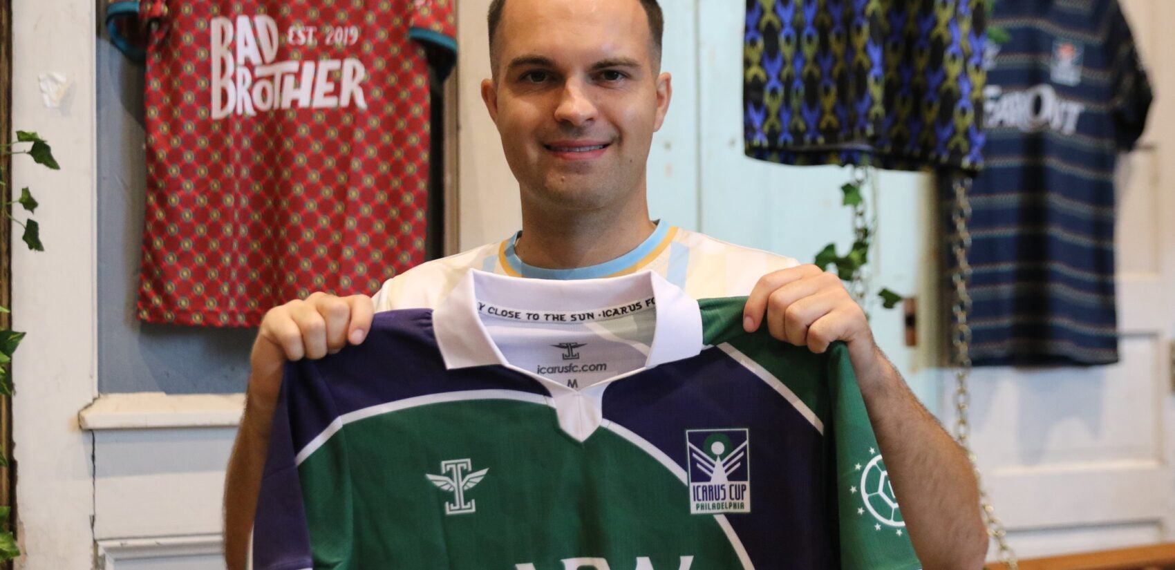 CASA Soccer's executive director picked up his kit ahead of the tournament during the launch party at Craft Hall on Friday. (Cory Sharber/WHYY)