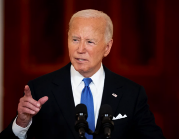 Joe Biden speaking at a podium