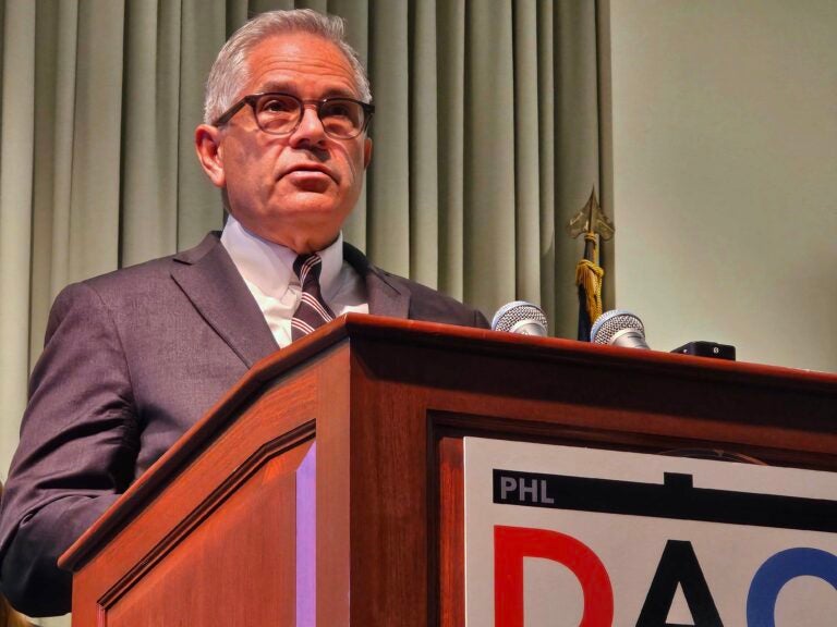 Larry Krasner at a podium