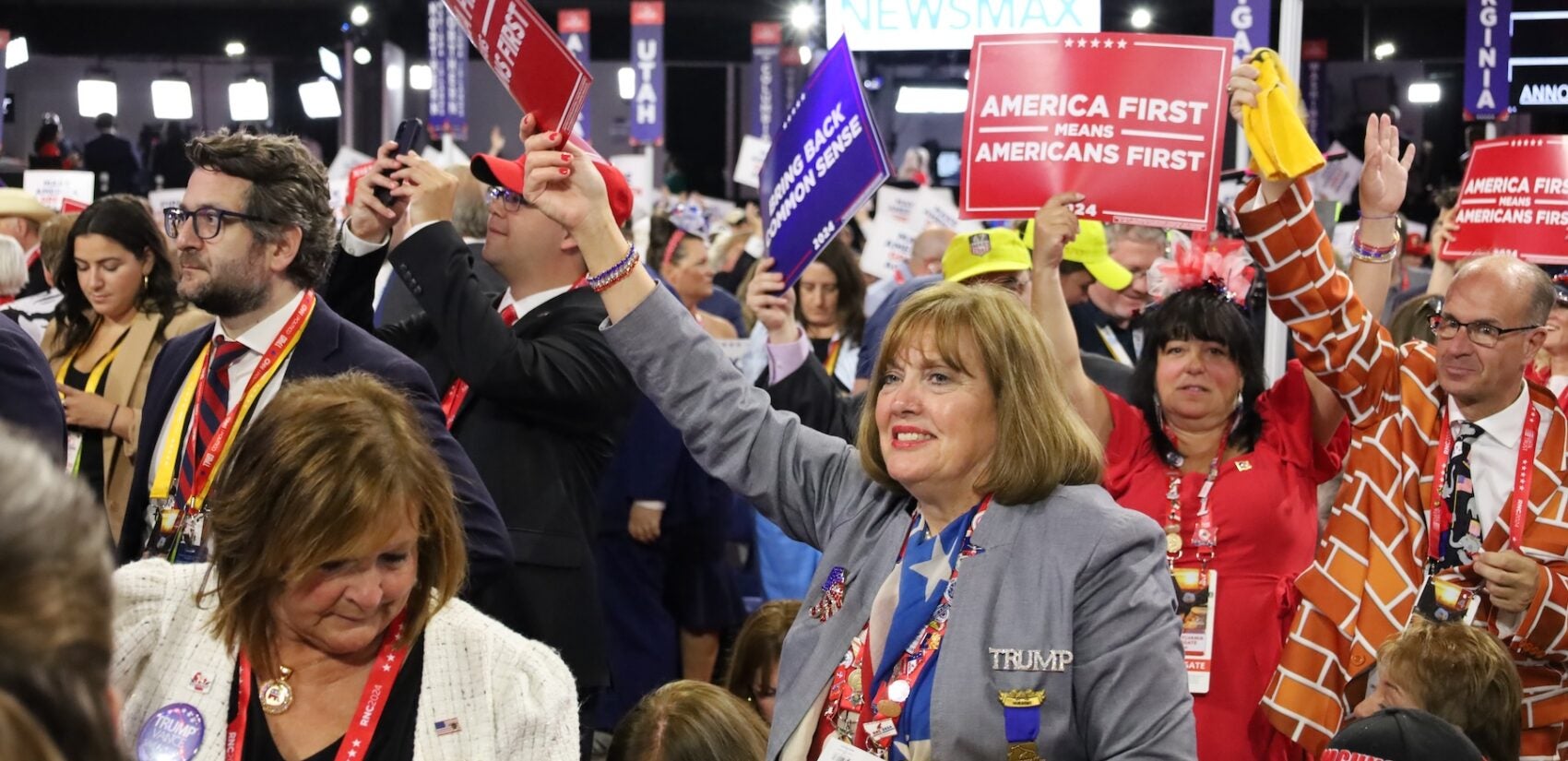 Delegates and supporters cheer at the convention