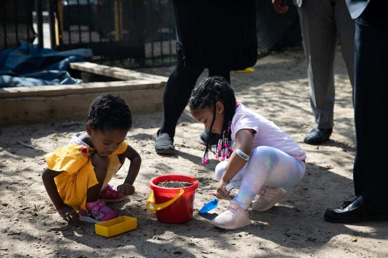 children playing in a sandbox