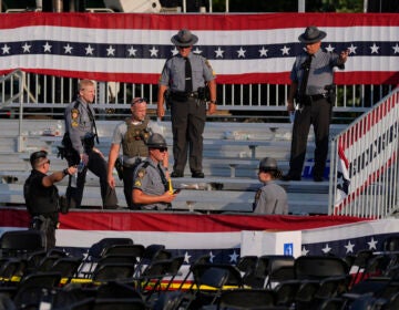 Law enforcement officers gather at the campaign rally site for Republican presidential candidate former President Donald Trump  Saturday, July 13, 2024, in Butler, Pa. Trump's campaign said in a statement that the former president was 