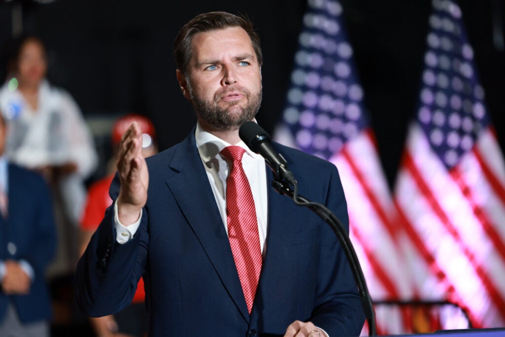 JD Vance speaking at a podium