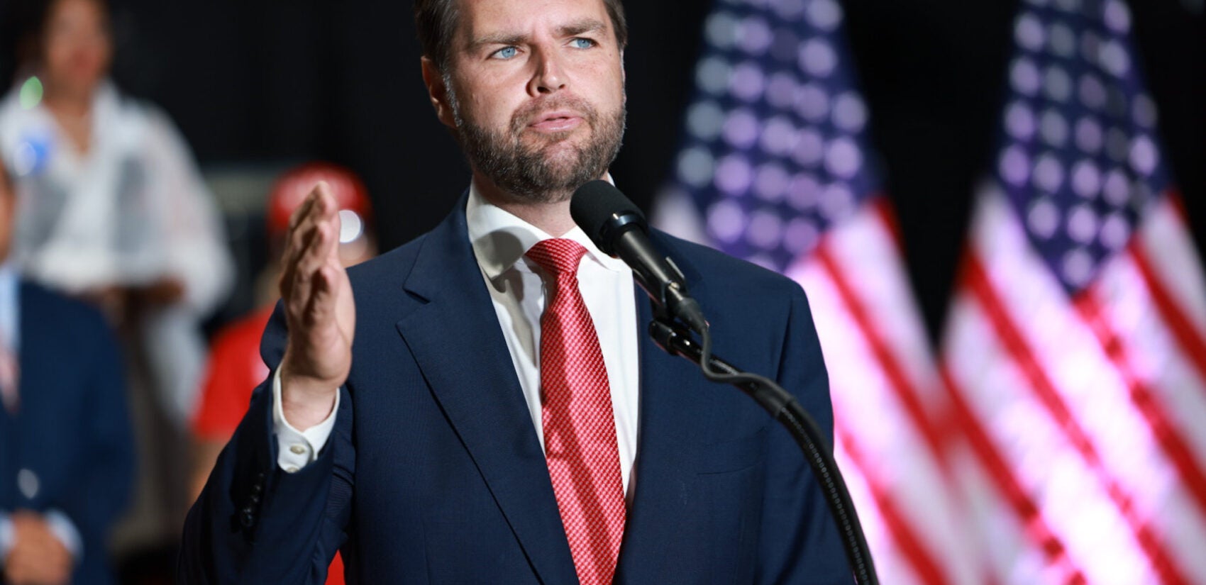 JD Vance speaking at a podium