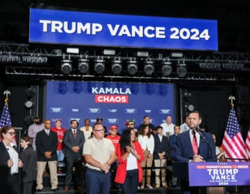 JD Vance speaking at a podium