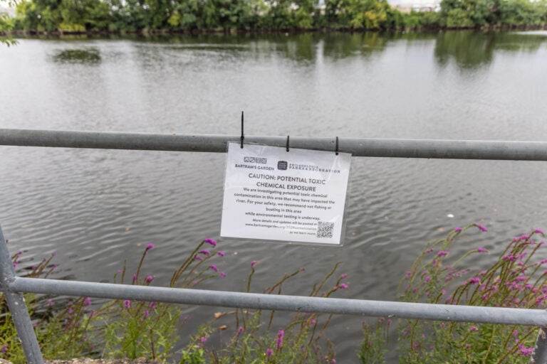 A sign from the dock of Bartram’s Garden warns of possible contamination on Aug. 7, 2024.