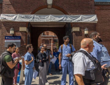 Residents are seen outside Penn Hospital