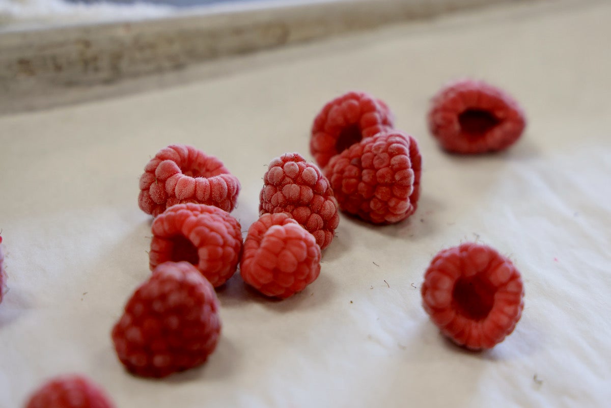 Flash-frozen raspberries retain their shape and texture because the rapid freezing process creates smaller ice crystals. (Emma Lee/WHYY)