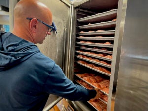 Robert Amar, owner of Small World Seafood in Philadelphia, freezes his fish at very cold temperatures to ensure freshness and quality. (Zoe Read/WHYY)