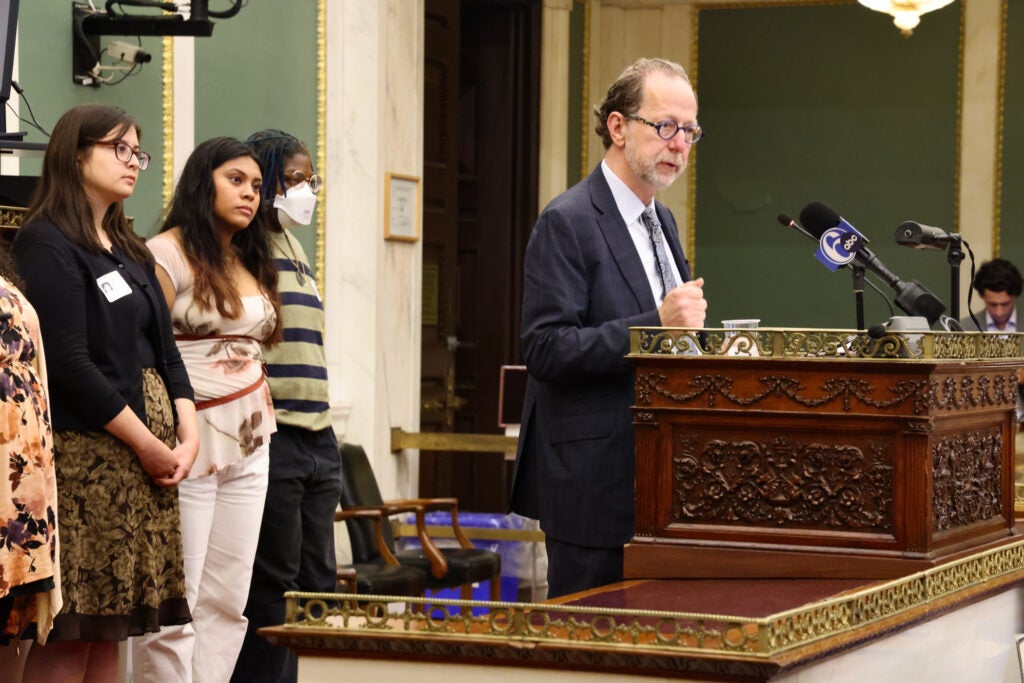 David R. Brigham speaking at a podium