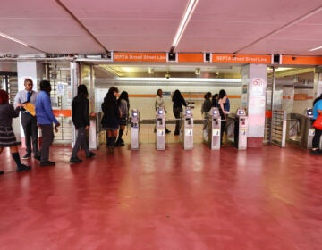 Passengers enter the Broad Street Line at the 15th Street Station