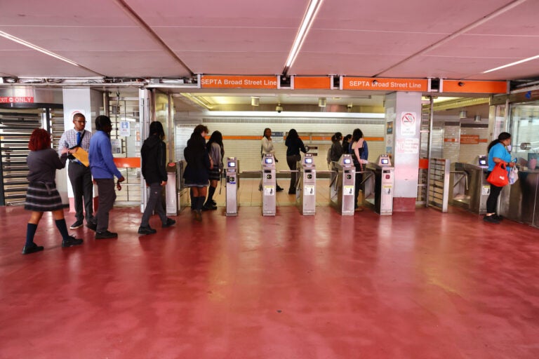 Passengers enter the Broad Street Line at the 15th Street Station