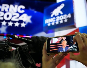 Corey Lewandowski is seen on the screen of a cellphone during a walkthrough at the 2024 Republican National Convention, Sunday, July 14, 2024, in Milwaukee. (AP Photo/Nam Y. Huh)