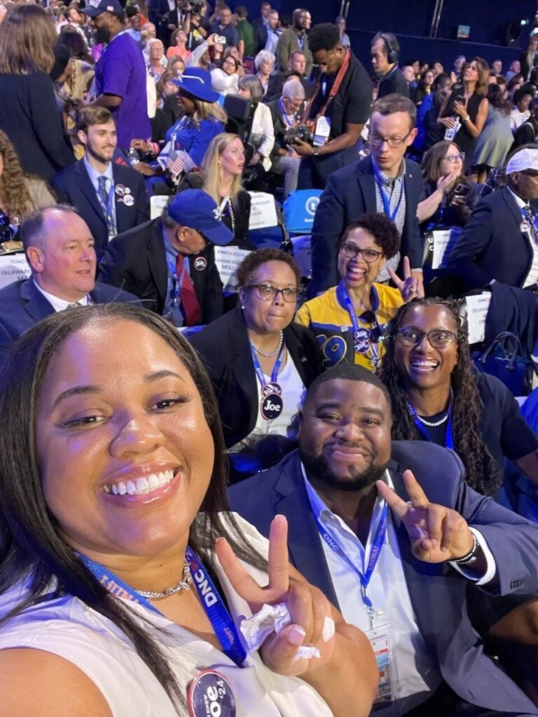 Amber Epperson and other delegates from Delaware pose for a photo at the Democratic National Convention