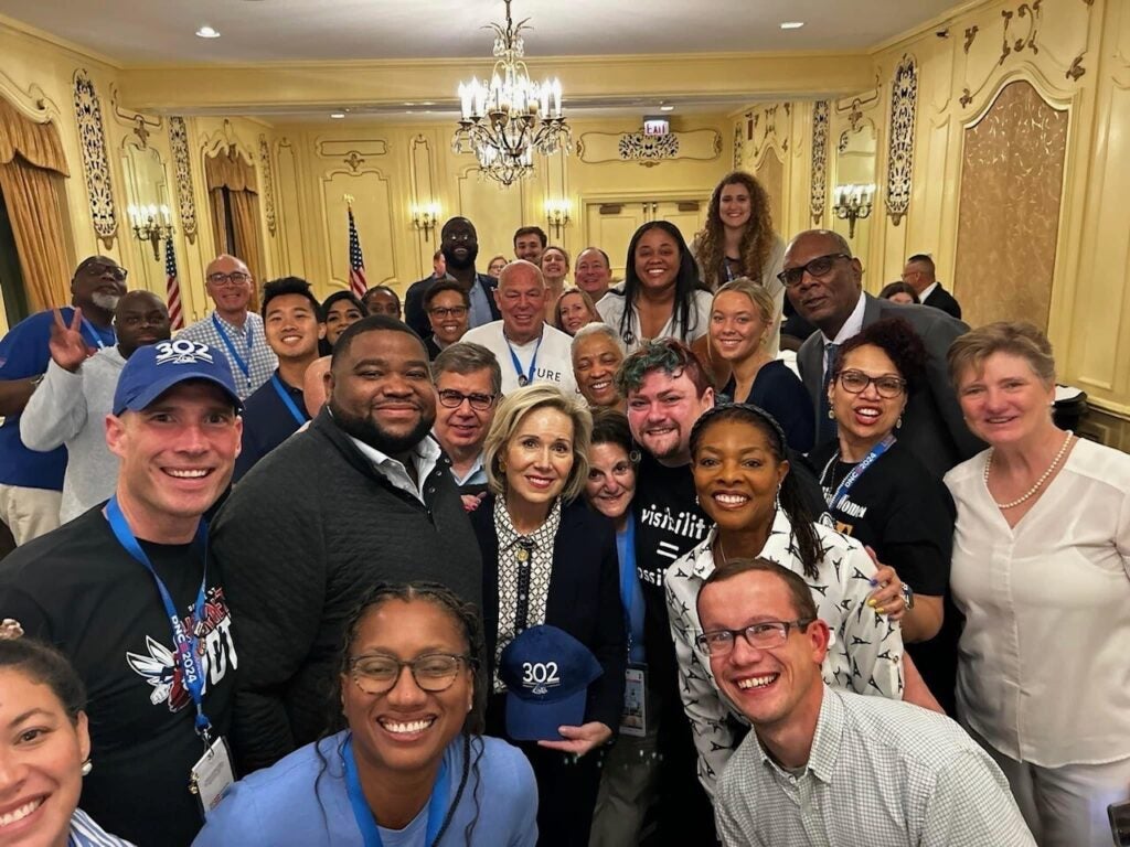 Delaware delegates pose with Gwen Walz, Minnesota Gov. Tim Walz's wife, at the Democratic National Convention in Chicago