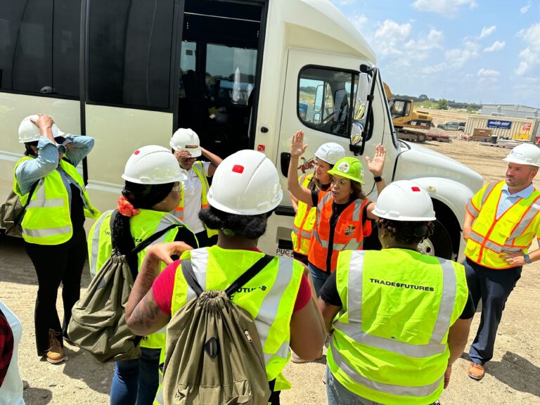 workers outside a bus