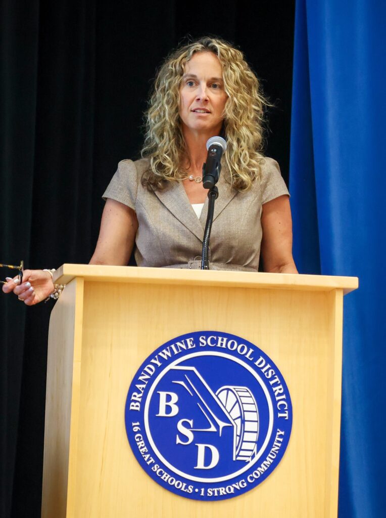 Lisa Lawson speaking at a podium