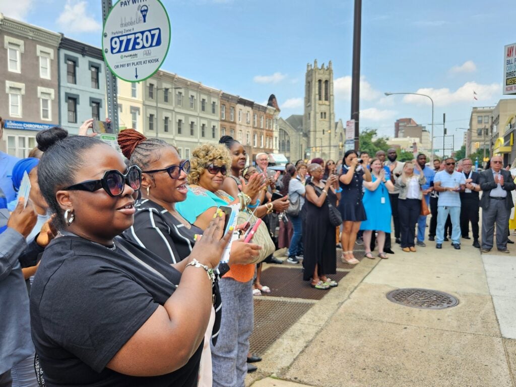 People gathered at the ribbon-cutting event