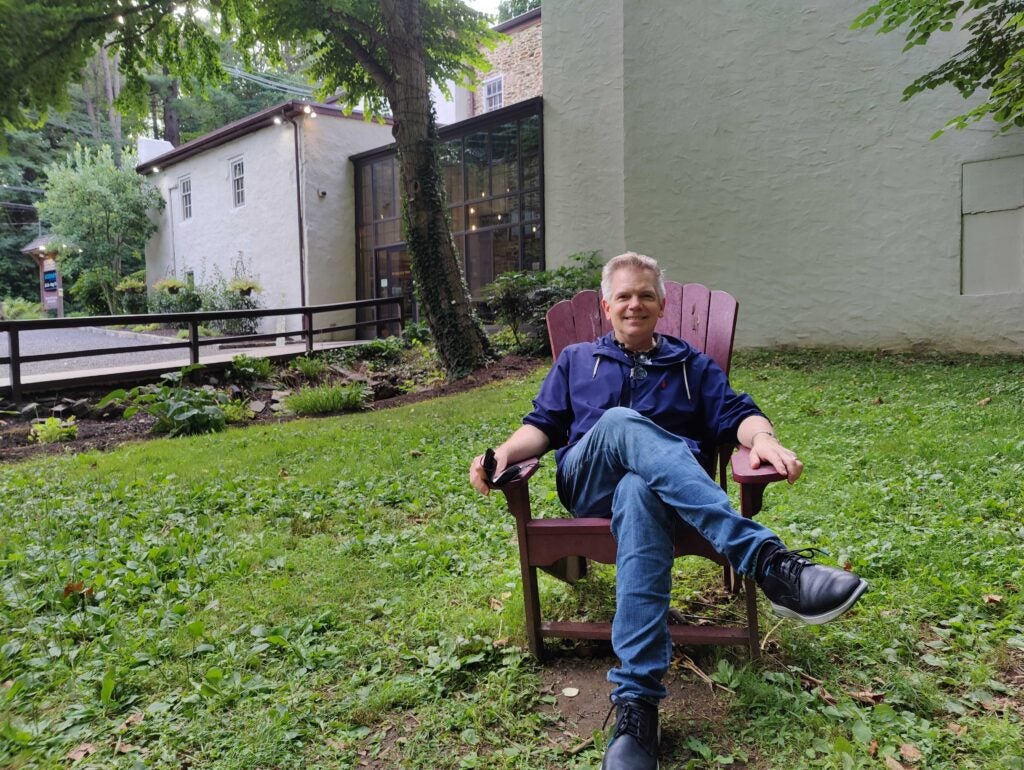 Peter Reynolds sits outside