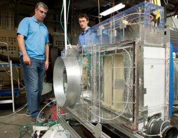 NREL engineers Eric Kozubal, left, and Jason Woods conduct initial research on the Blue Frontier prototype, the first sustainable HVAC system capable of reducing CO2 emissions by 85%. (Photo by Dennis Schroeder/NREL 20175)