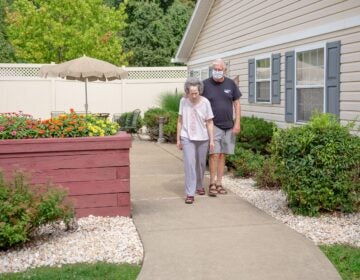 people walking in a long-term care facility