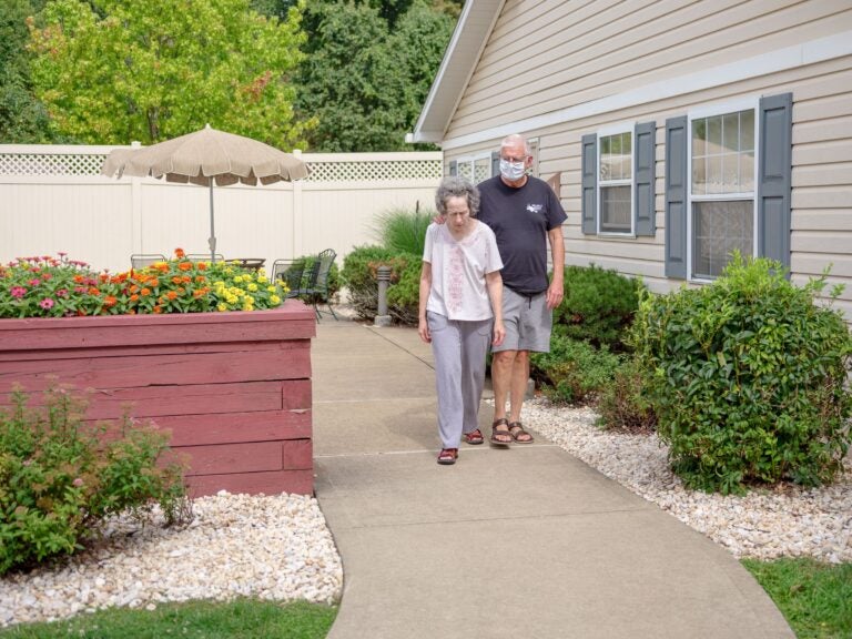 people walking in a long-term care facility